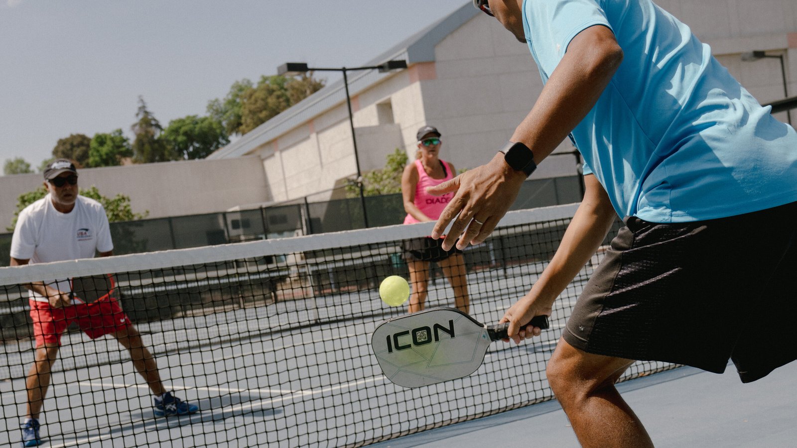 Pickleball players training at the kitchen line